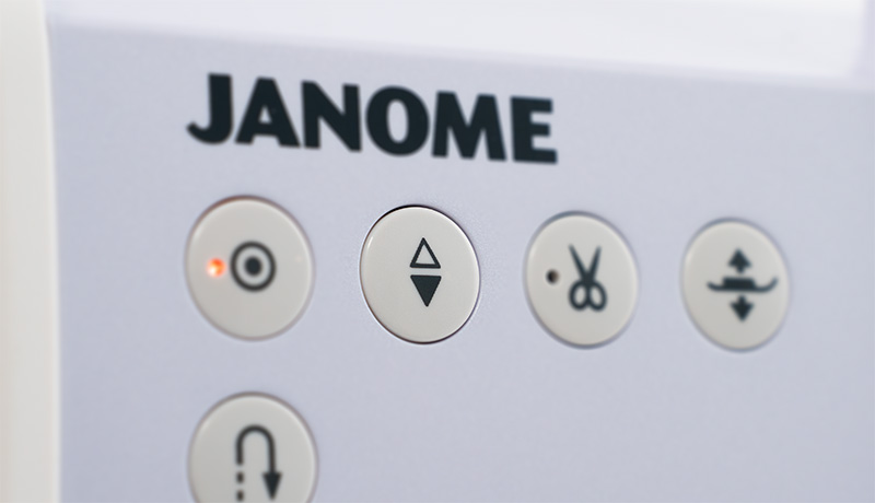 Janome Continental M6 Needle up/down button